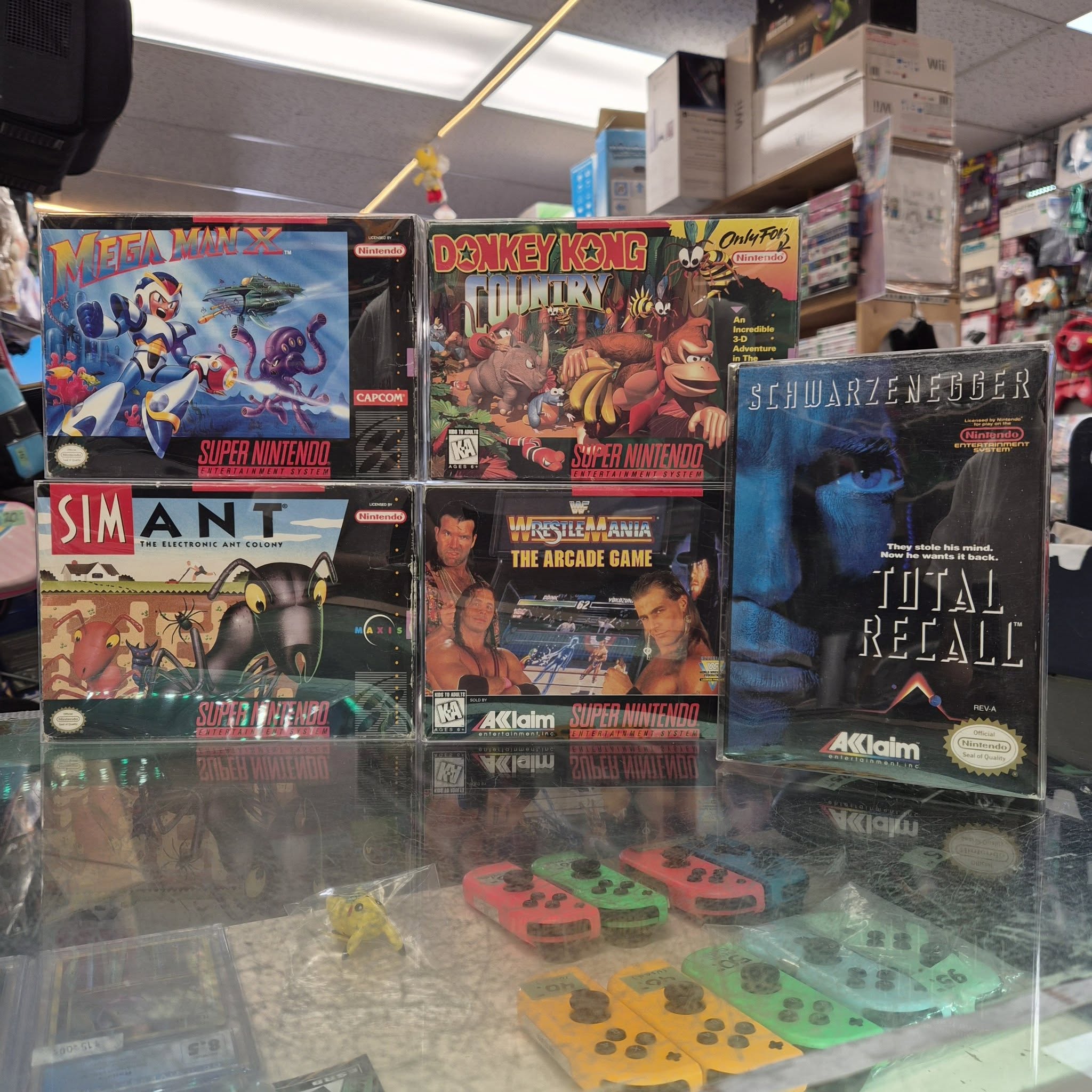 Second batch of SNES games and NES Total Recall in box at Hometech Games Plus